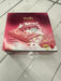 Box of Angel Flair raspberry chocolate candy on a tiled floor