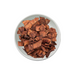 White bowl filled with chocolate coconut chips. Distributed by AFRIVANA